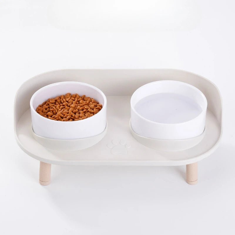 Ergonomic elevated pet bowls in a bamboo stand, featuring non-slip design for comfortable cat and dog feeding