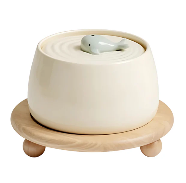 Pet feeding solution: a wooden stand with two ceramic bowls, perfect for keeping feeding area tidy.