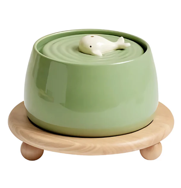 Contemporary elevated pet feeder, wooden base holding two pristine ceramic bowls for pet food and water.