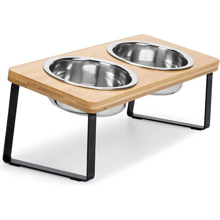 Elevated pet food bowl set with two stainless steel dishes in a modern wooden stand for dogs and cats.