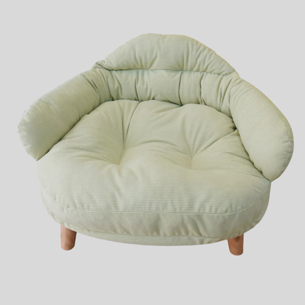 Elevated wooden pet bed with a thick, cozy cushion, perfect for small cats or dogs.