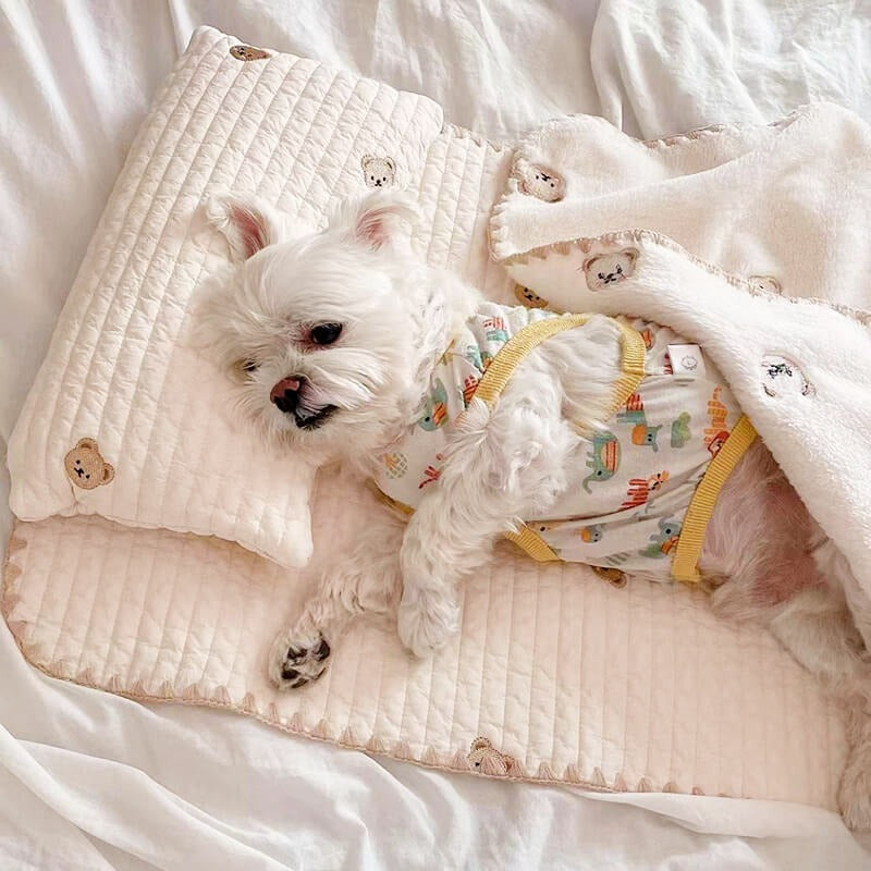 Embroidered cotton dog bed set with pillow and quilted blanket, ideal for cozy pet comfort