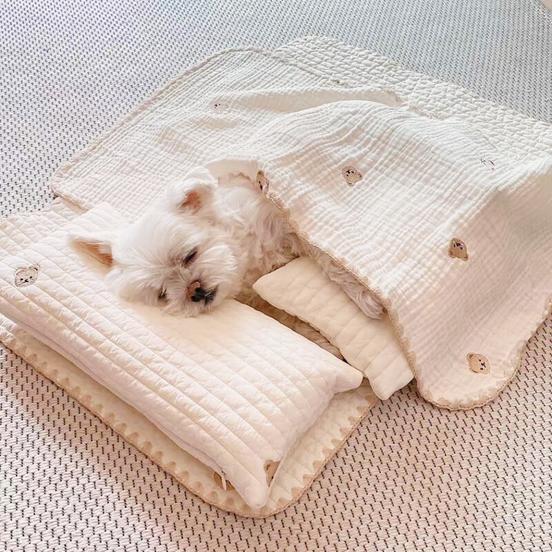 Soft cotton pet bed with blue embroidery, includes a matching pet pillow and washable quilt