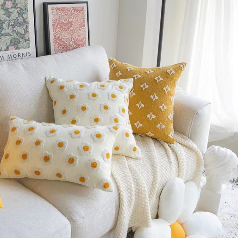 Close-up of Embroidered Flower Throw Pillow, showcasing intricate flower and leaf embroidery