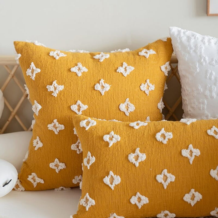 Soft decorative throw pillow with embroidered flower design, perfect for home decor