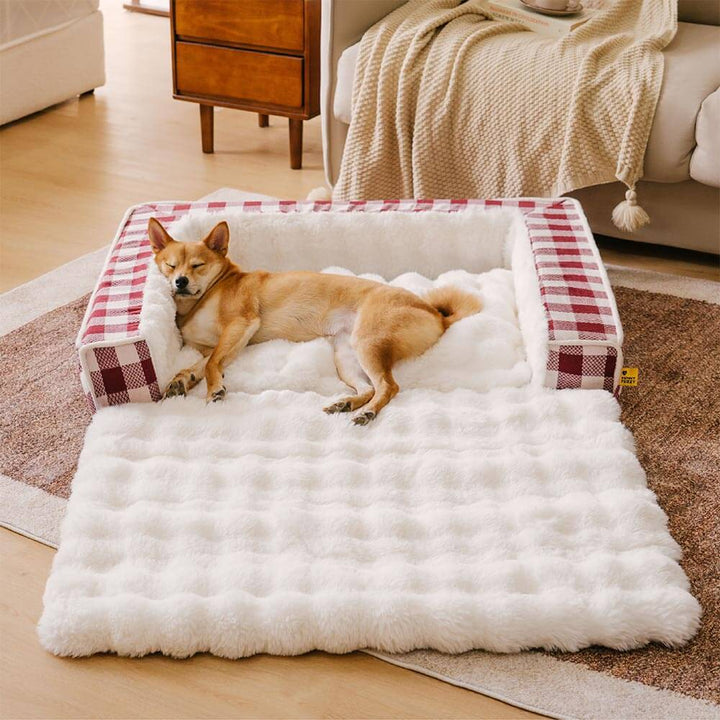 Ergonomic calming dog bed with a gray plaid pattern, expandable design for pet comfort.