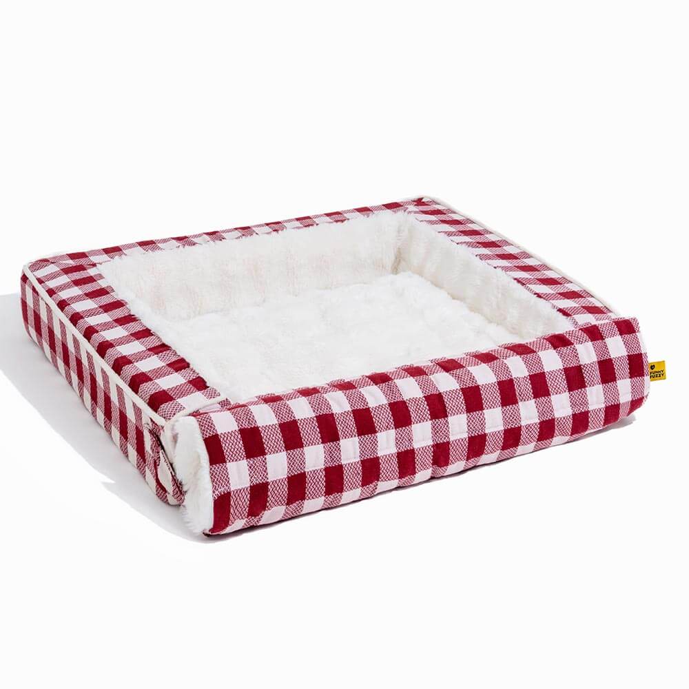 Plaid pet bed, ergonomic and calming, featuring an expandable base for versatility.