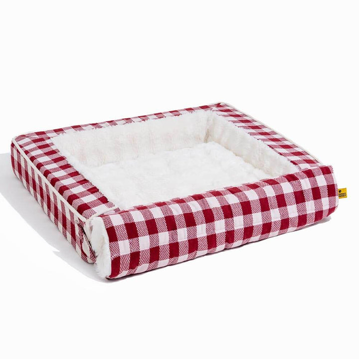 Plaid pet bed, ergonomic and calming, featuring an expandable base for versatility.