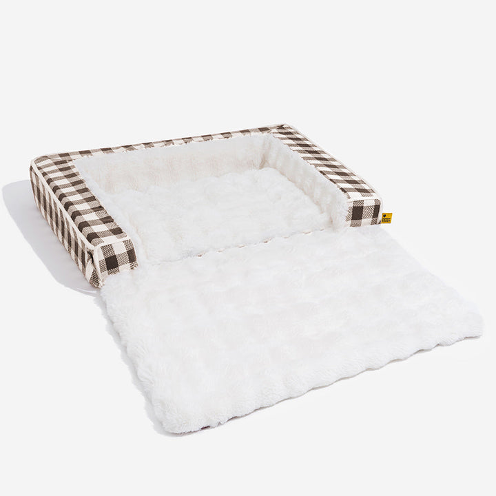 Dog comfort item: ergonomic plaid bed, expandable, washable, and calming for pets.