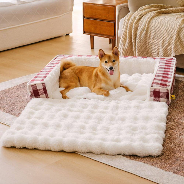 Expandable ergonomic dog bed featuring a classic gray plaid fabric, washable.