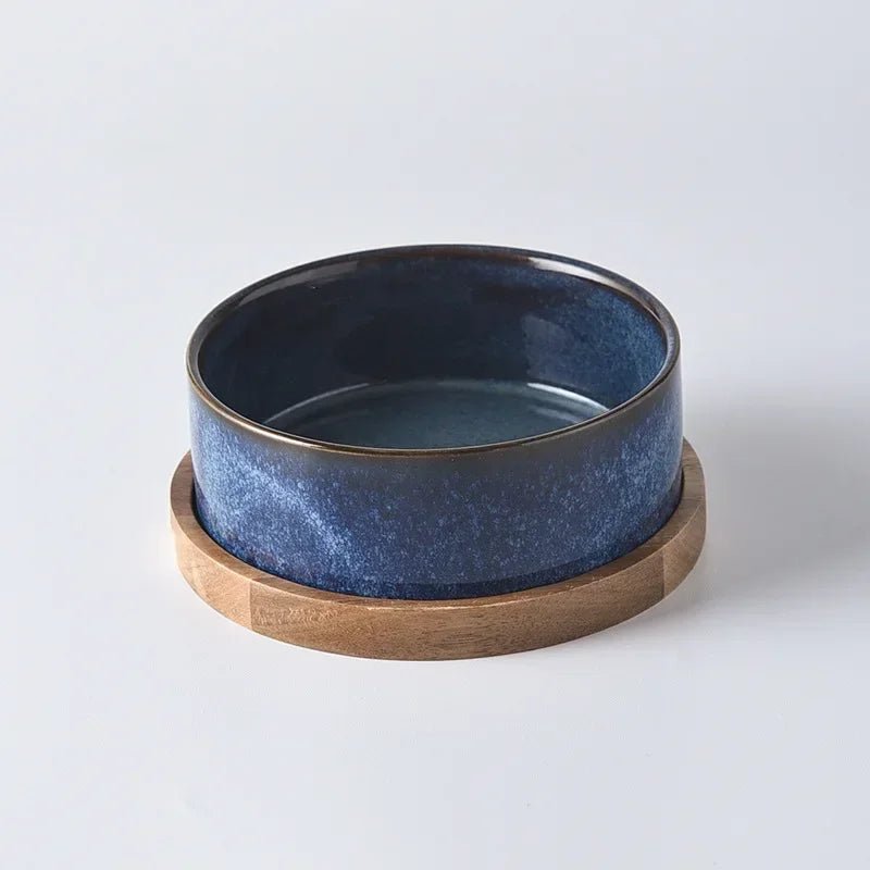 Ergonomic ceramic pet bowl with a wooden stand, ideal for dogs and cats, promoting comfortable feeding.