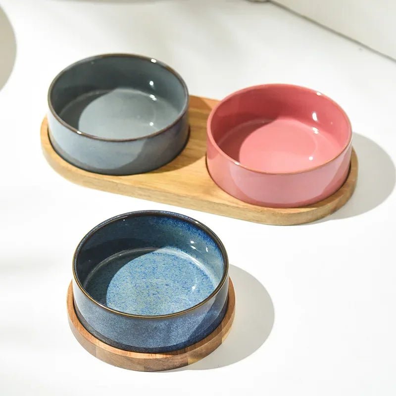 White ceramic pet bowl on a natural wooden stand, an elevated feeder for healthier pet posture.