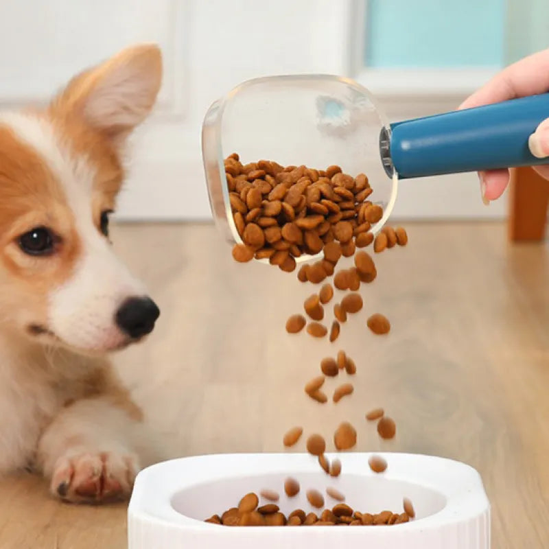 Ergonomic measuring spoon for dry food, rice scoop, and pet feeder. White plastic kitchen tool.