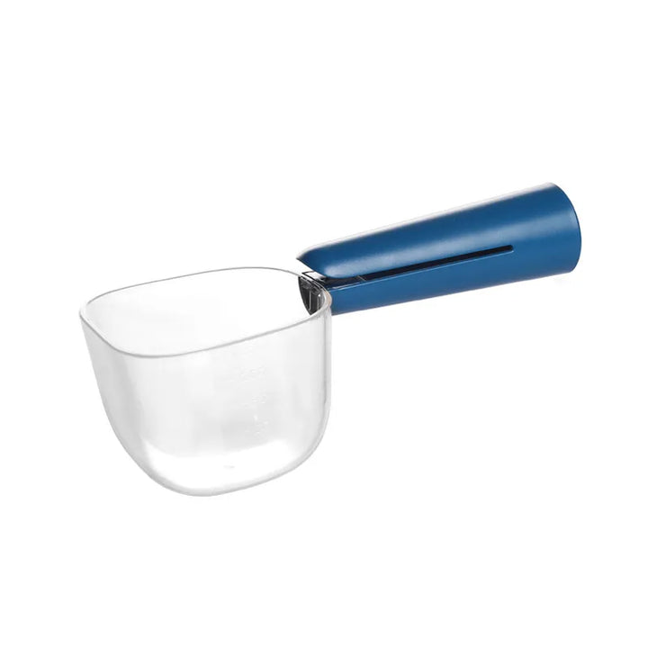 Ergonomic rice scoop and dry food measuring spoon, perfect for kitchen and pet feeding, shown on a counter.
