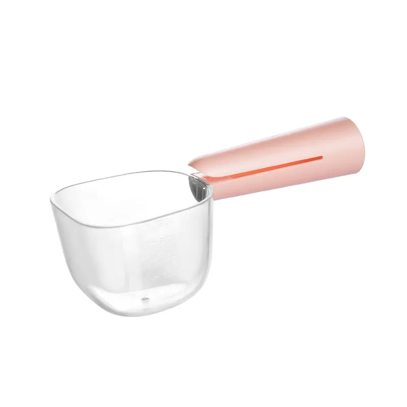 White plastic ergonomic measuring spoon, designed for easy scooping of dry food, rice, and pet kibble.