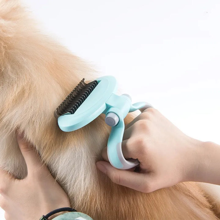 Ergonomic pet de-matting brush with a 360° rotating head, ideal for dog and cat grooming.