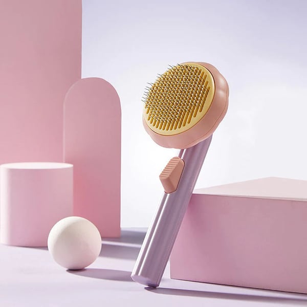 Cat being groomed with the comfortable ergonomic pet brush, a high-quality grooming tool for pet massage.