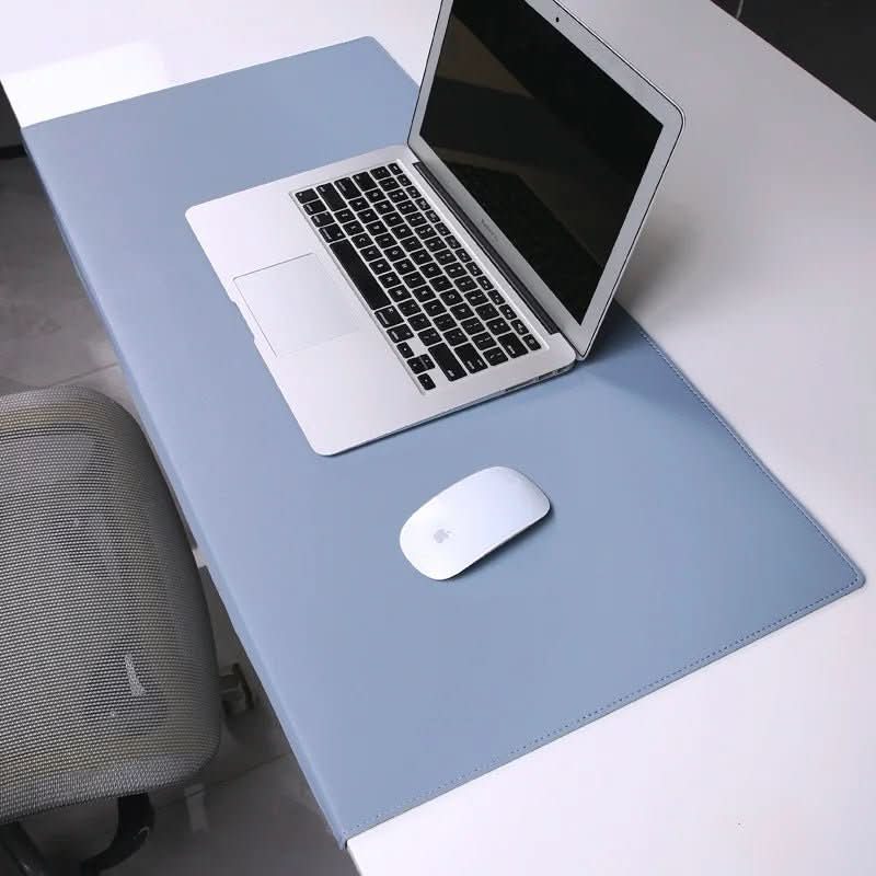 Smooth PU leather desk mat with integrated ergonomic wrist support for typing comfort & desk protection.