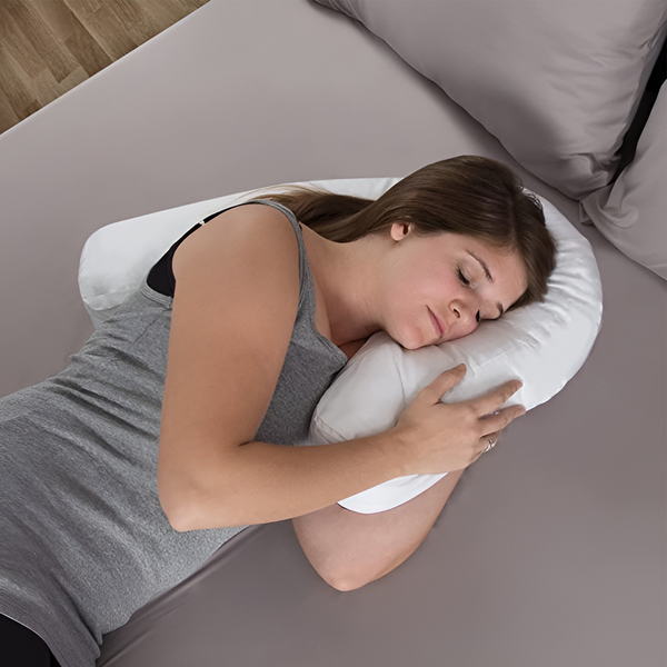 Ergonomic side sleeper pillow with ear hole for neck & back support, offering pain relief & comfortable sleep.