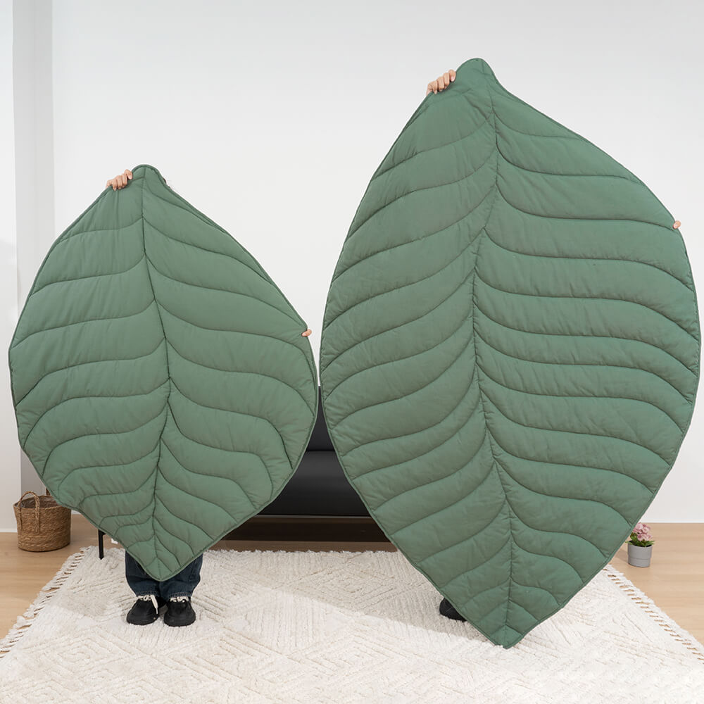 A cozy, extra large leaf shape pet and human mat, comfortable dog blanket, perfect for modern home decor.