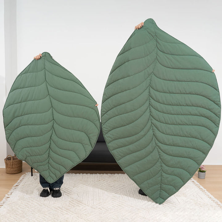 A cozy, extra large leaf shape pet and human mat, comfortable dog blanket, perfect for modern home decor.