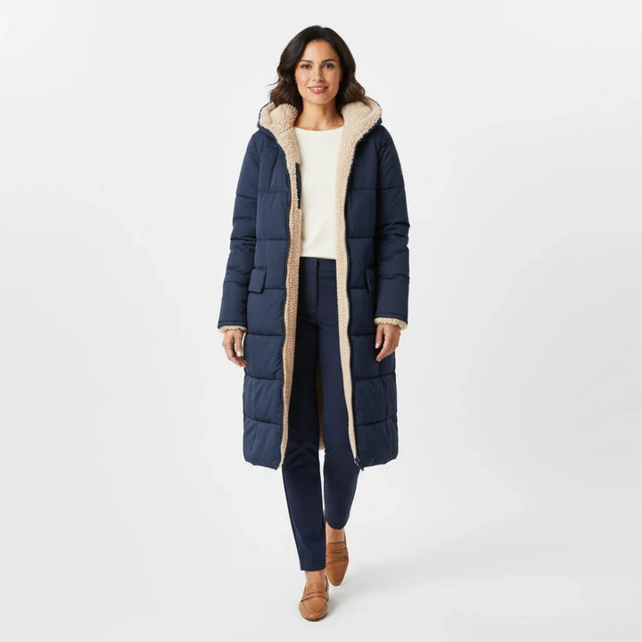 Cozy hooded winter jacket for women, stylish and long for full coverage.