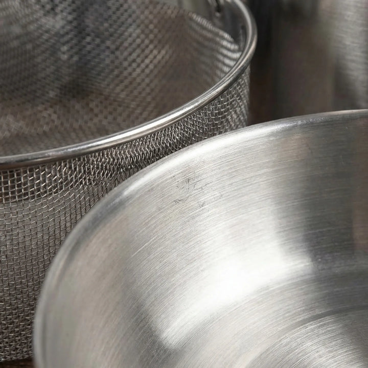 Durable stainless steel outdoor cookware set, perfect for family camping and easy, complete camp meal preparation.