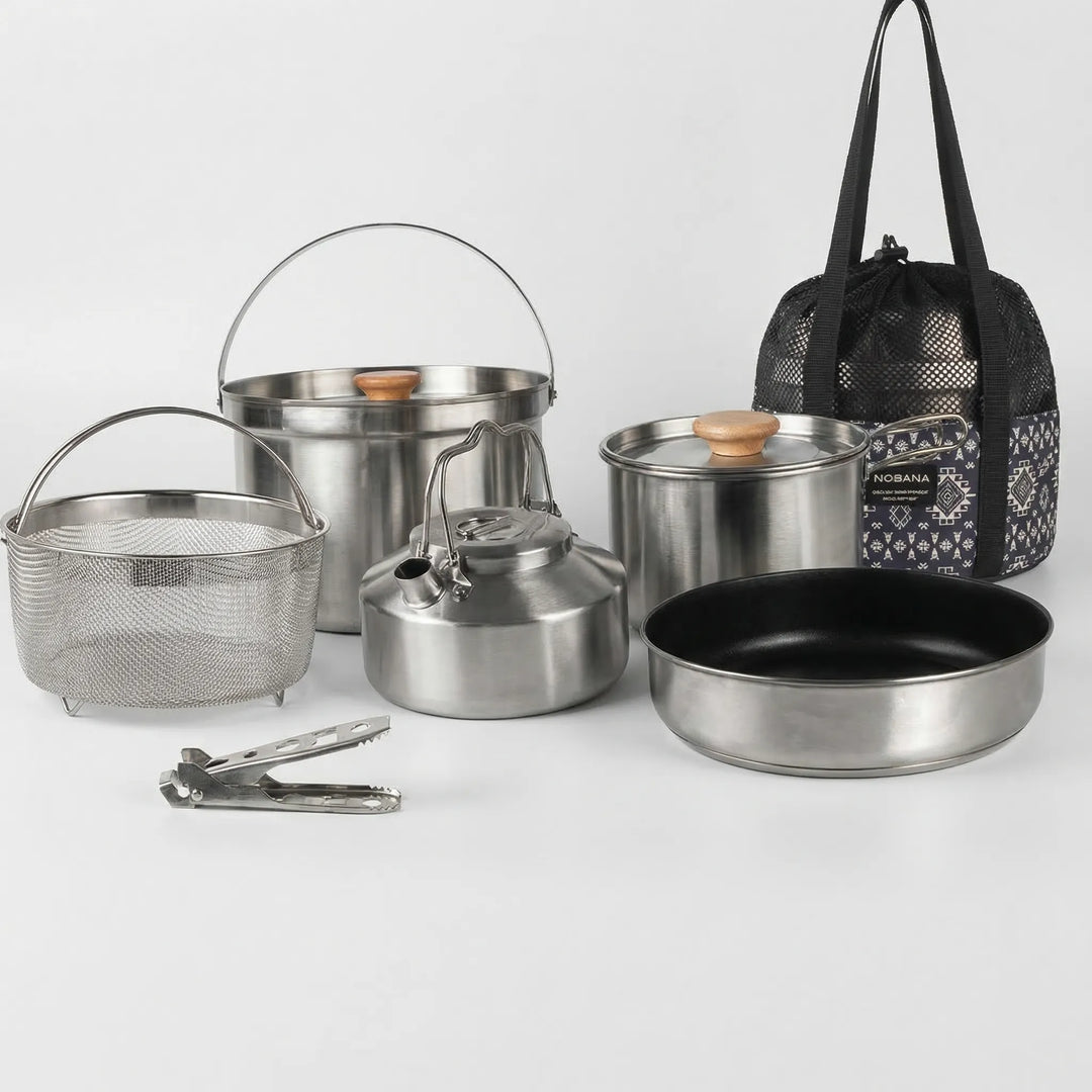 Family using a portable outdoor cookware set to prepare a delicious camp meal at a scenic campsite.