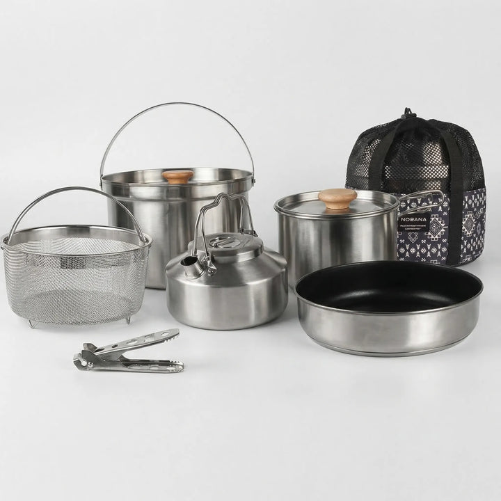 Versatile family outdoor cookware set, enabling diverse camp meals, from boiling water to frying food.