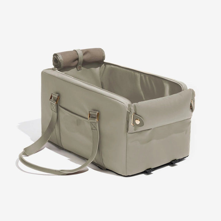 Unisex pet travel carrier and car seat, fits center console, secure and comfortable for small pets.
