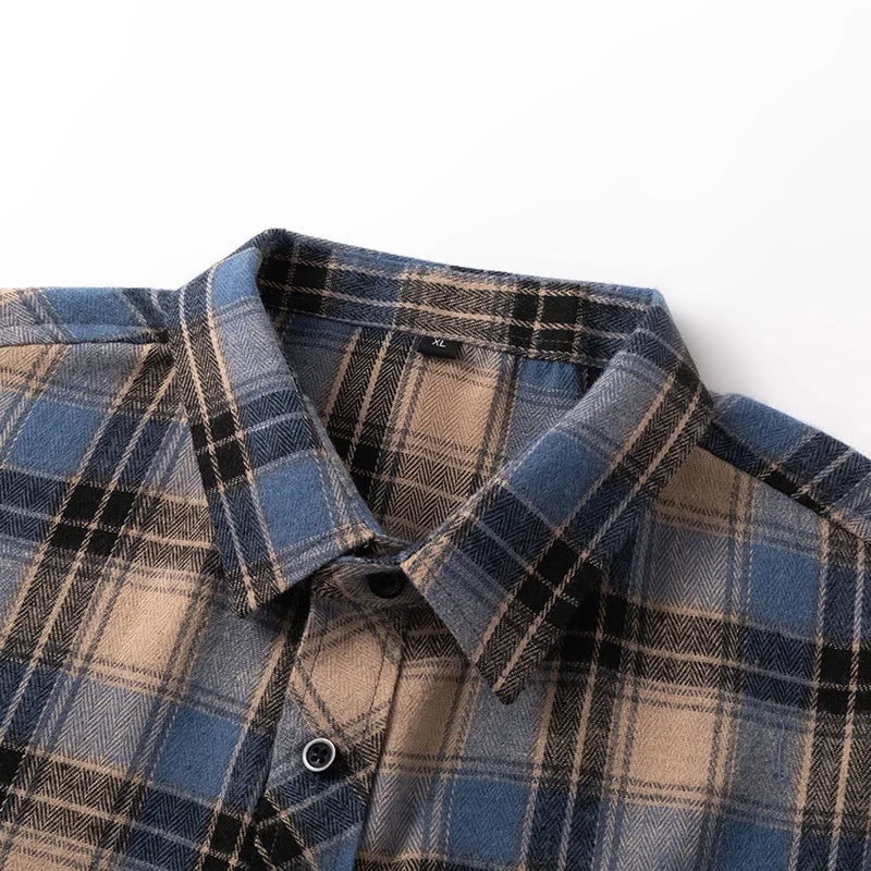 Relaxed fit men's button-down plaid flannel shirt in blue, a versatile fall & winter essential.
