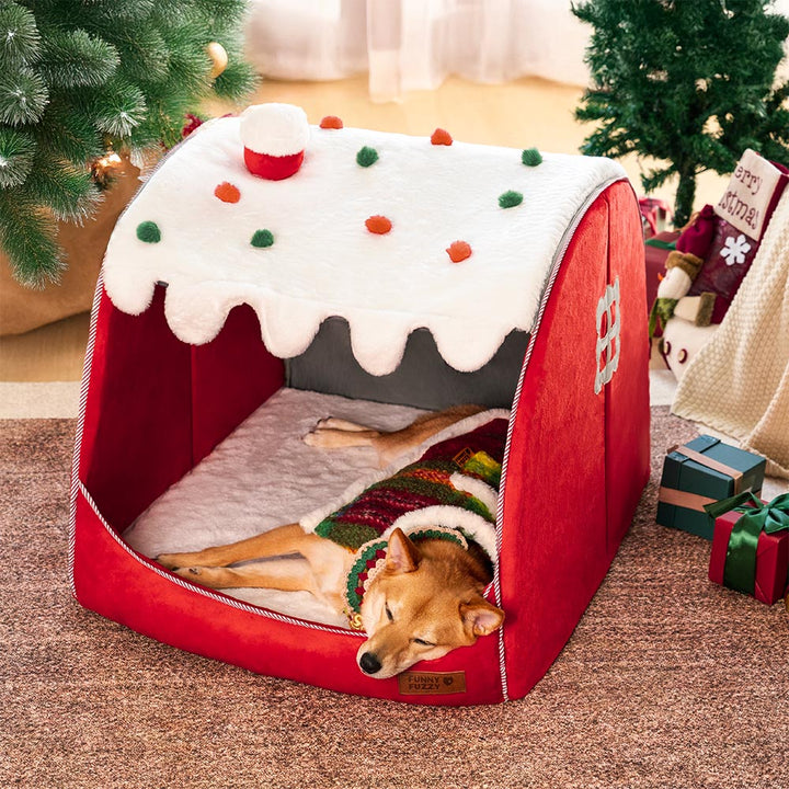 Holiday decor meets pet comfort with this festive snow house orthopedic dog bed