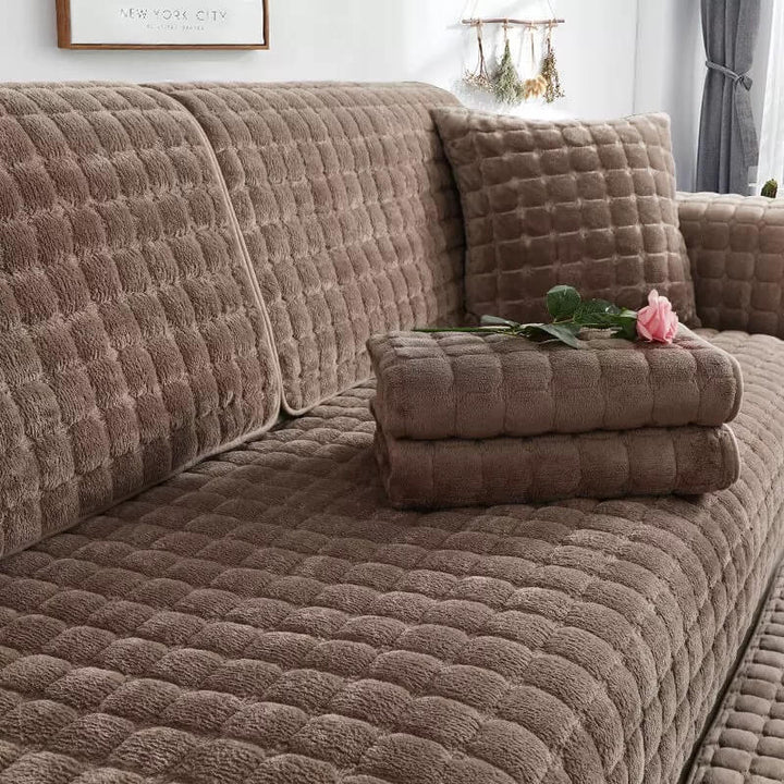 Close-up of quilted flannel couch cover texture, showing non-slip and scratch-resistant features
