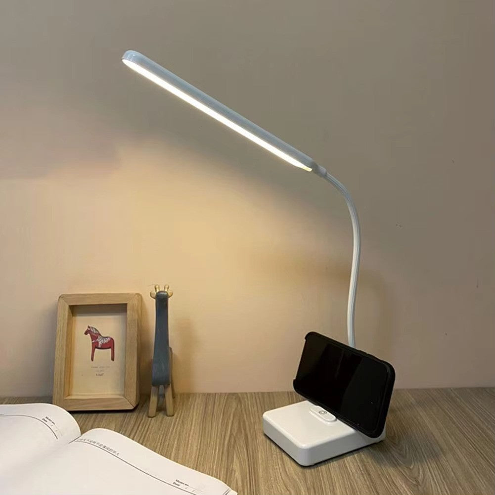 Minimalist flexible LED lamp for desks, providing bright, adjustable light. USB or AC plug powered.