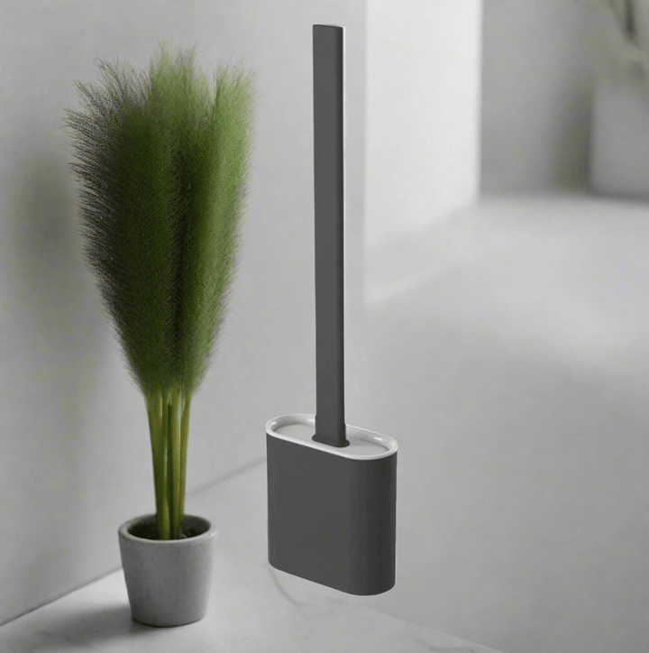 Flexible silicone toilet brush removes tough stains, ensuring sanitary deep cleaning for a fresh bathroom. Hygiene tool.