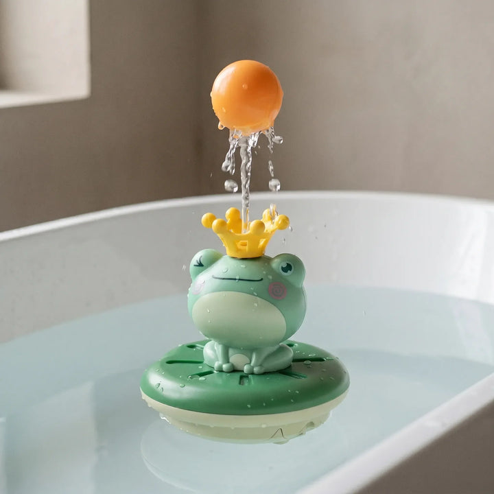 Floating frog bath sprinkler toy for kids, an interactive water toy for happy toddler bathtime fun.