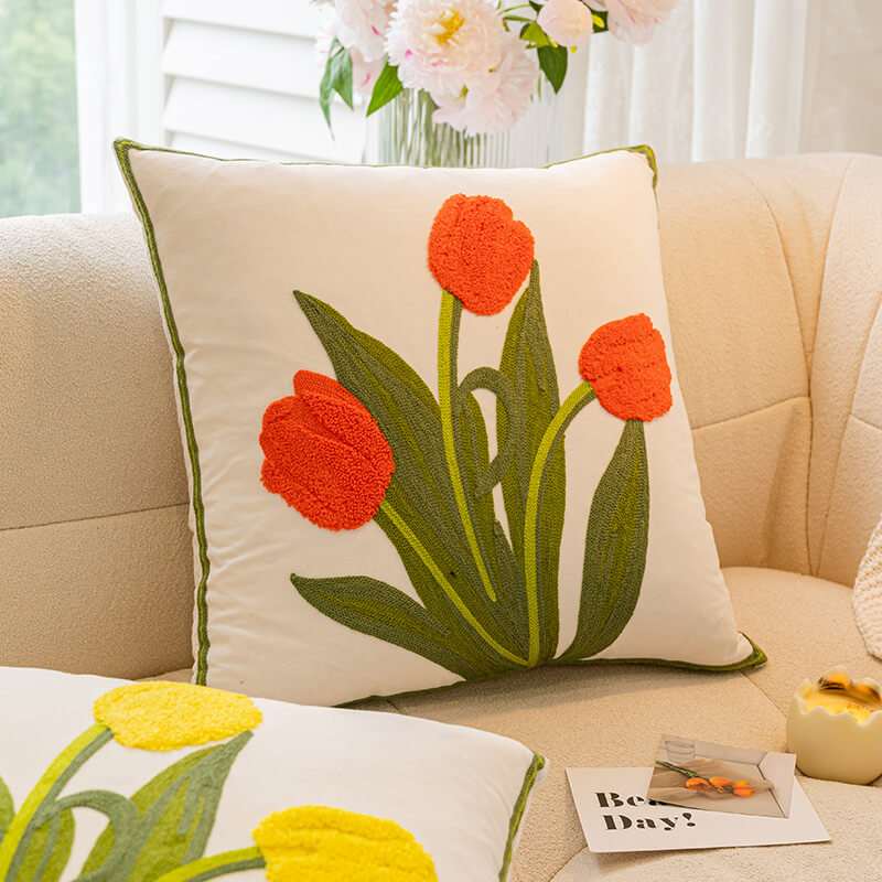 Living room sofa featuring a colorful Floral Bouquet Decorative Pillow and other cushions