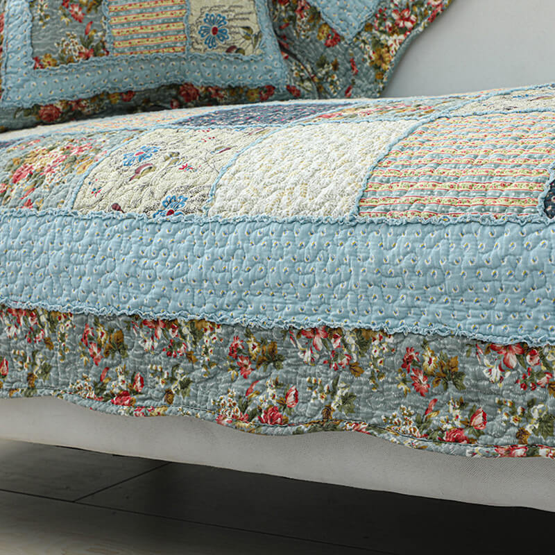 Corner of a sectional sofa with a stylish floral plaid cotton blend cover