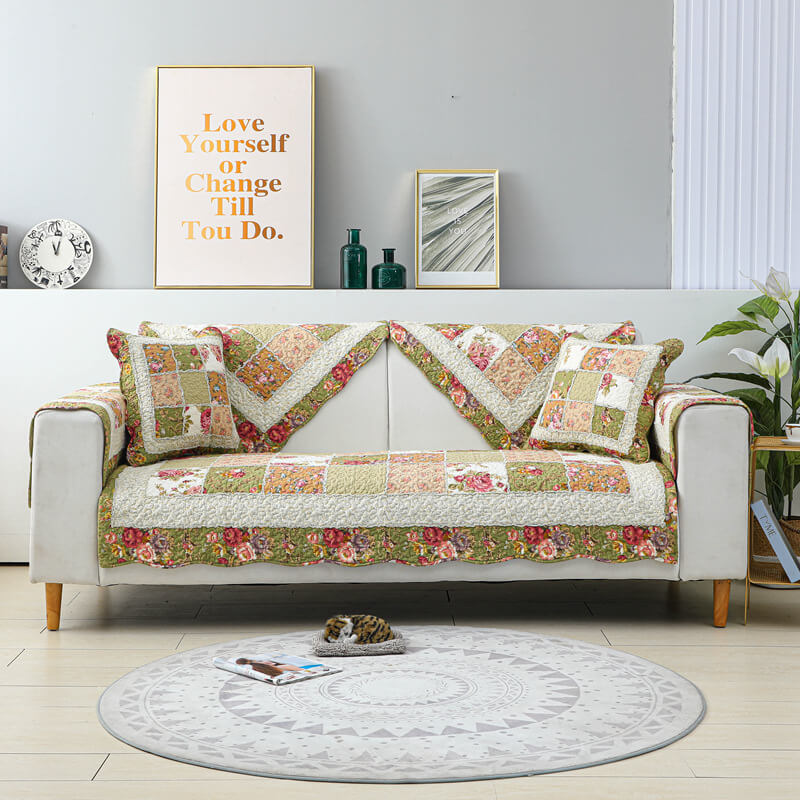 Elegant floral plaid sofa cover draped over a three-seater couch