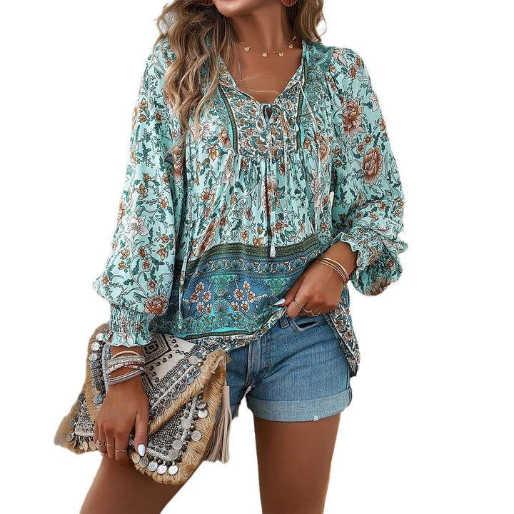 Vibrant women's floral blouse, a flowy boho top with puff sleeves, ideal for spring casual chic and vacation.