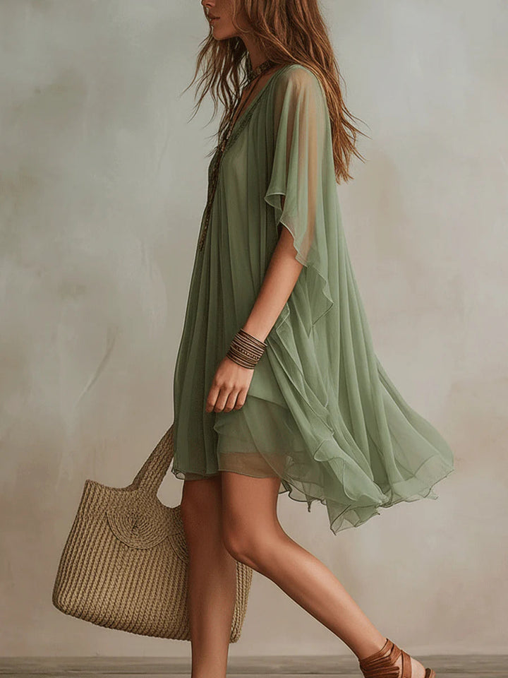 Women's tiered V-neck green mini dress; a flowy, layered summer dress with a relaxed fit for comfort.