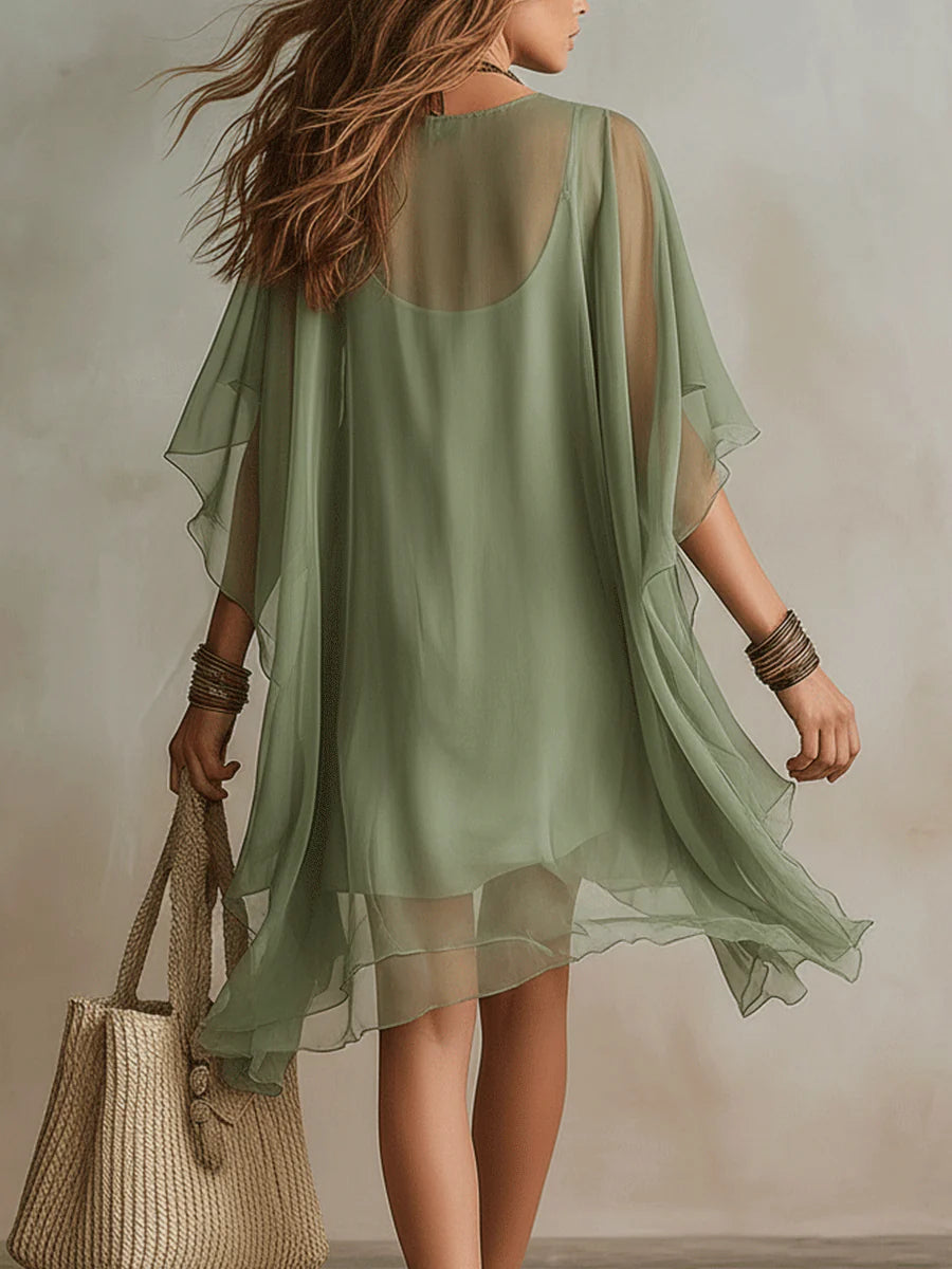 Casual women's green mini dress with flowy layers, ideal for summer outings, beachwear, or relaxed style.