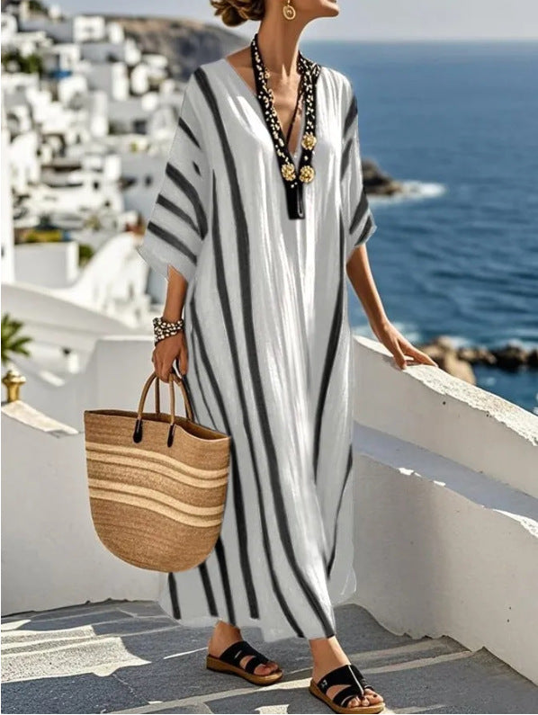 Elegant women's flowy kaftan maxi dress, relaxed resort style. Perfect comfortable summer & vacation wear.