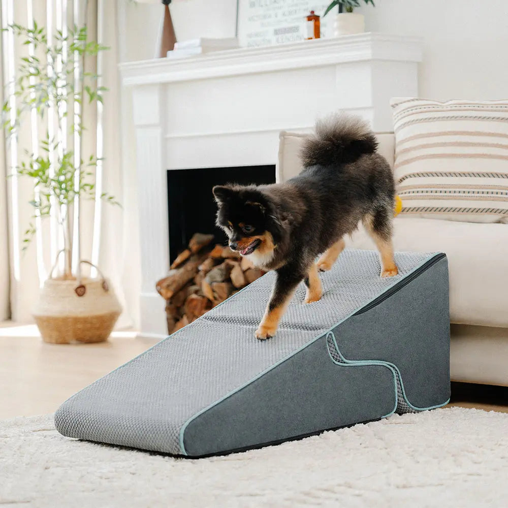 Grey washable cover on a foldable pet ramp and stairs, providing joint support for aging pets.