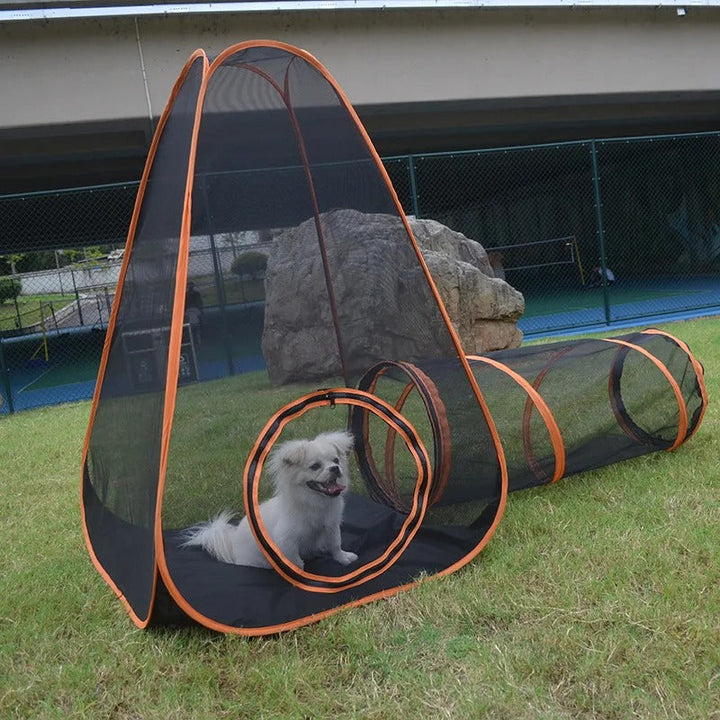 Portable dog playpen set up outdoors on grass, showing ample space for pets. Ideal for travel and pet safety.