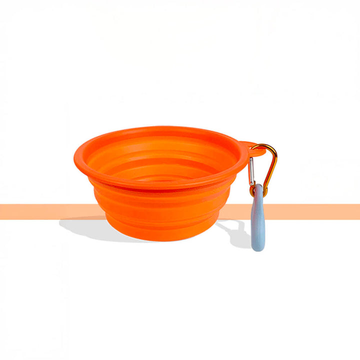 Durable red silicone foldable pet bowl, essential dog accessory for camping and hikes.