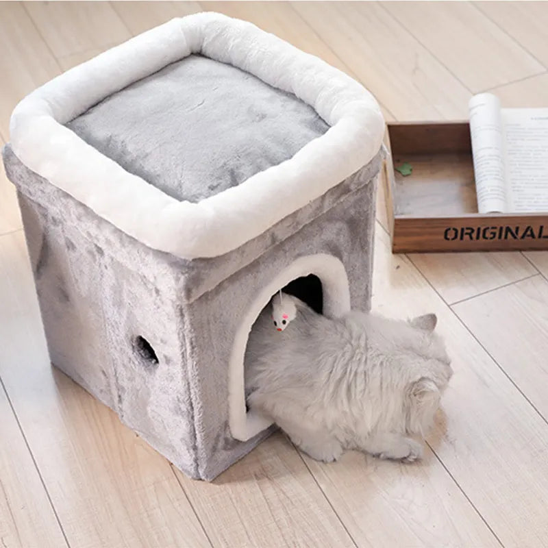 Small foldable cat cave bed with integrated toy, offering a secure and comfortable retreat for feline pets