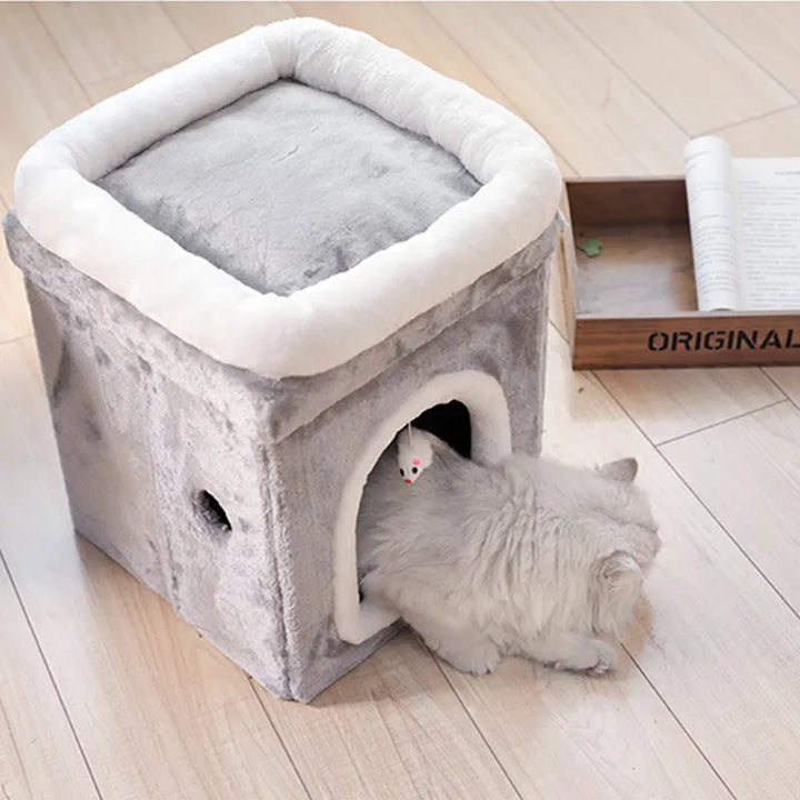 Small foldable cat cave bed with integrated toy, offering a secure and comfortable retreat for feline pets