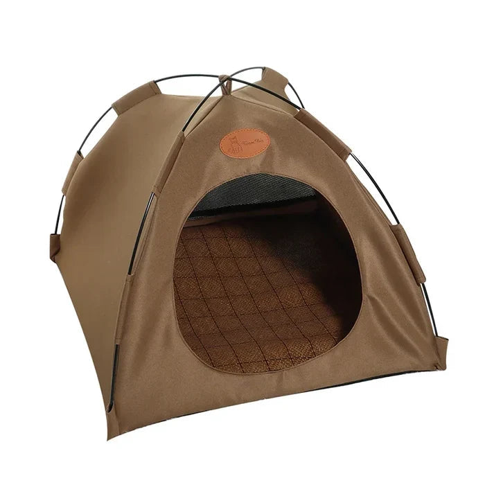 Collapsible cat house demonstrating foldability, compact dark gray pet bed, travel-friendly