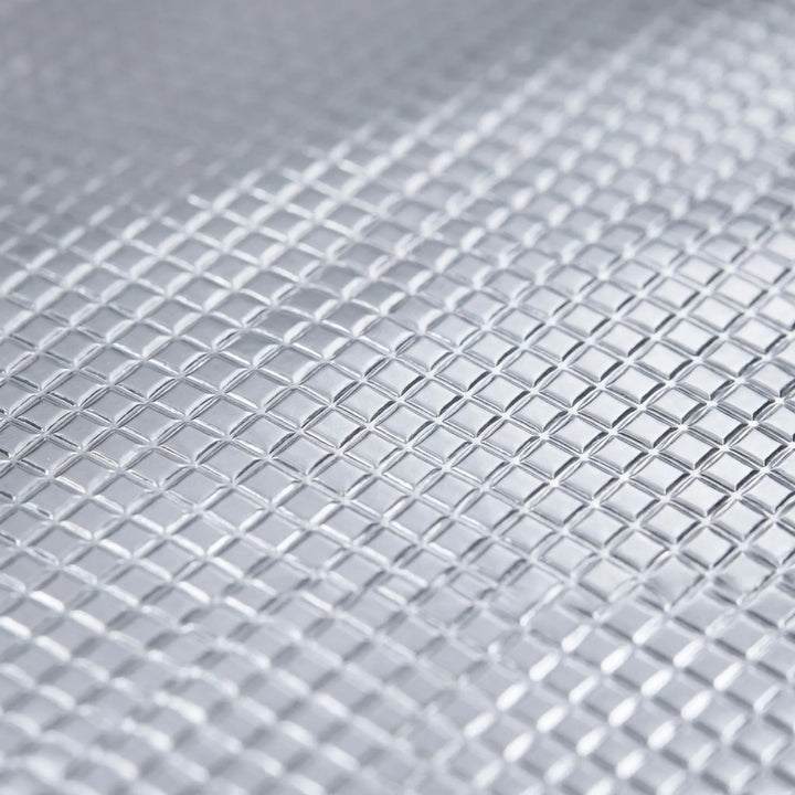 Reflective surface foldable camping mat for enhanced thermal insulation during outdoor adventures.